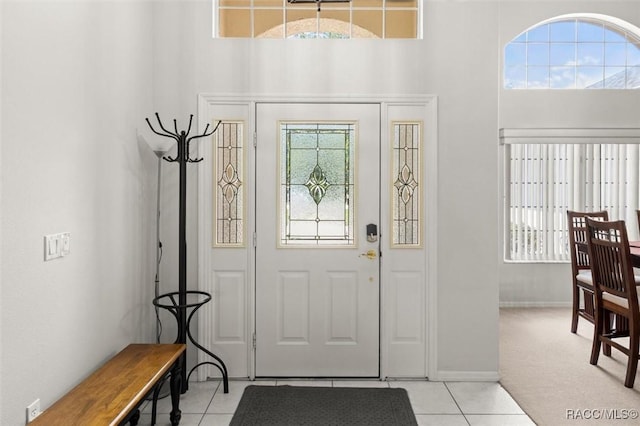9989 N Langdon Rd, Citrus Springs, FL 34434 - foyer entrance with light tile patterned floors and a towering ceiling