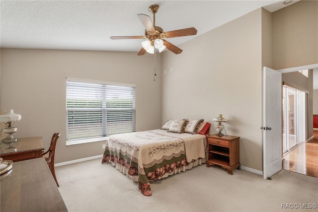 5694 W Hunters Ridge Cir, Lecanto, FL 34461 - carpeted bedroom with lofted ceiling, baseboards, and ceiling fan