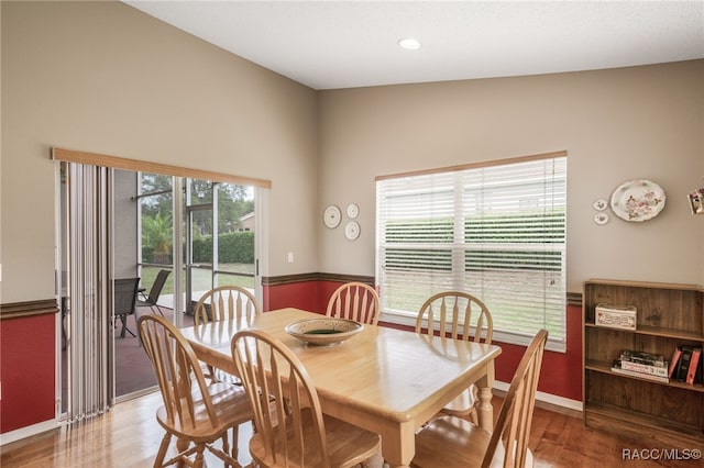 5694 W Hunters Ridge Cir, Lecanto, FL 34461 - dining space featuring wood finished floors and baseboards