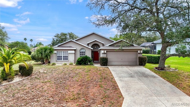 5694 W Hunters Ridge Cir, Lecanto, FL 34461 - single story home with stucco siding, a garage, driveway, and a front lawn