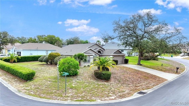 5694 W Hunters Ridge Cir, Lecanto, FL 34461 - view of front of house featuring concrete driveway, a garage, and a front yard