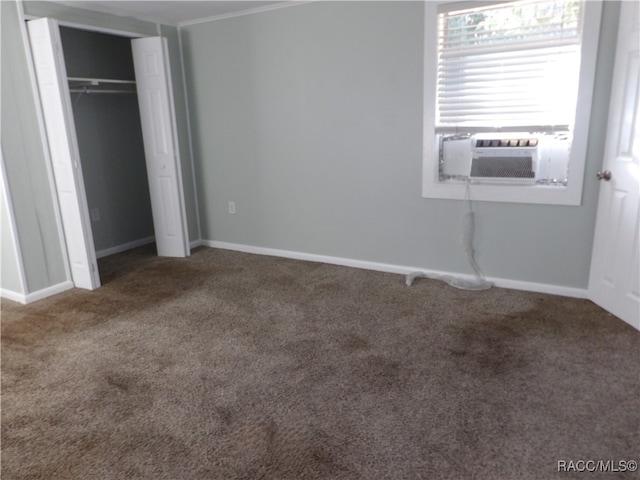 unfurnished bedroom with carpet and a closet
