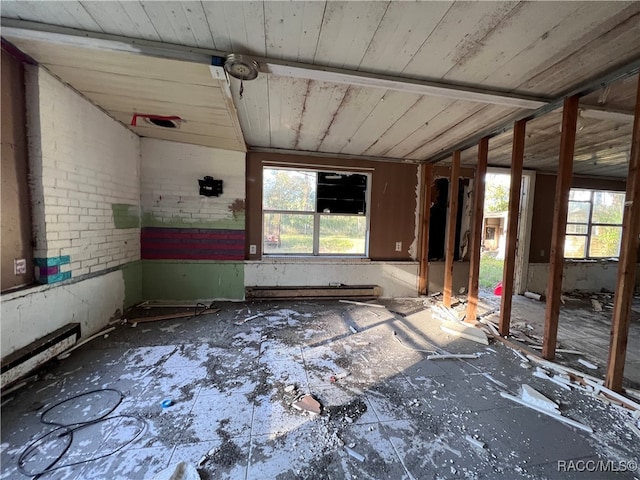 interior space with a baseboard radiator, wooden ceiling, and lofted ceiling