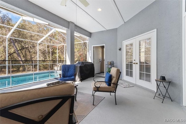 interior space with french doors and ceiling fan