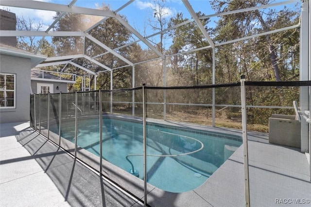 view of pool featuring a lanai, a patio area, and a fenced in pool