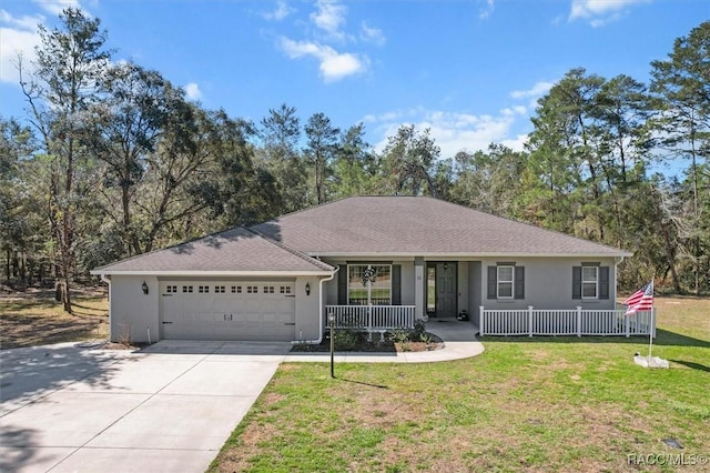 ranch-style home featuring stucco siding, a porch, concrete driveway, an attached garage, and a front yard