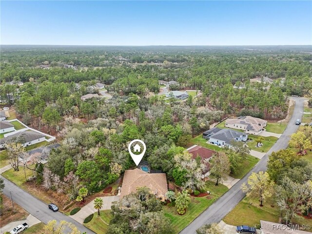 aerial view featuring a view of trees