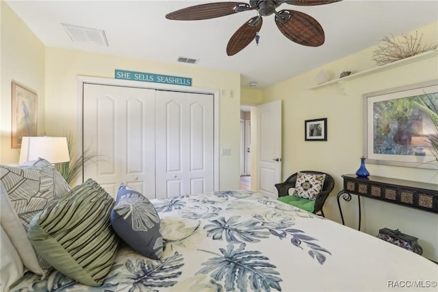 bedroom featuring visible vents, a closet, and ceiling fan