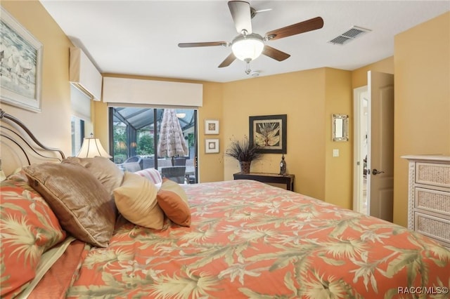 bedroom with visible vents, a sunroom, a ceiling fan, and access to outside