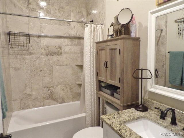 full bathroom with vanity, toilet, and shower / bath combo with shower curtain