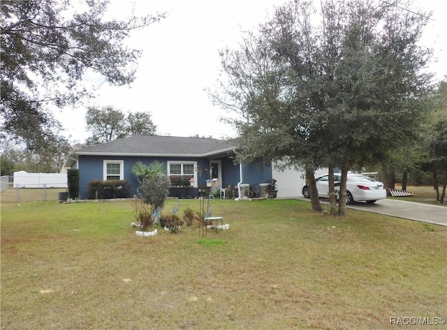 single story home with a garage and a front lawn