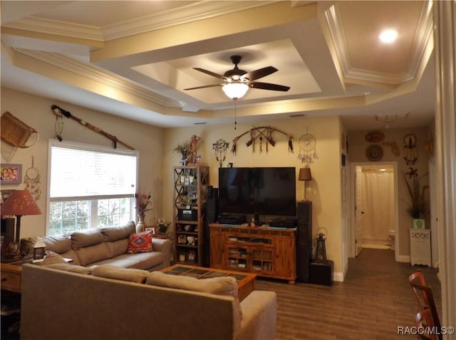 living room featuring ceiling fan, wood-type flooring, and crown molding