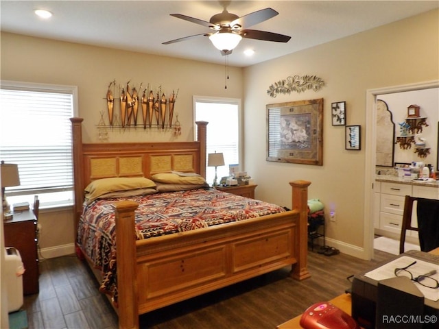 bedroom with ceiling fan and dark hardwood / wood-style floors