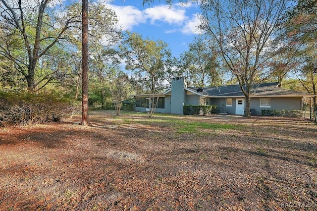 view of yard featuring a sunroom