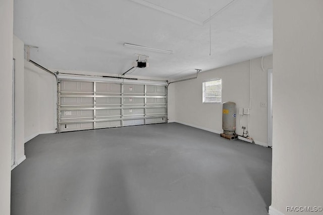 garage featuring baseboards and a garage door opener