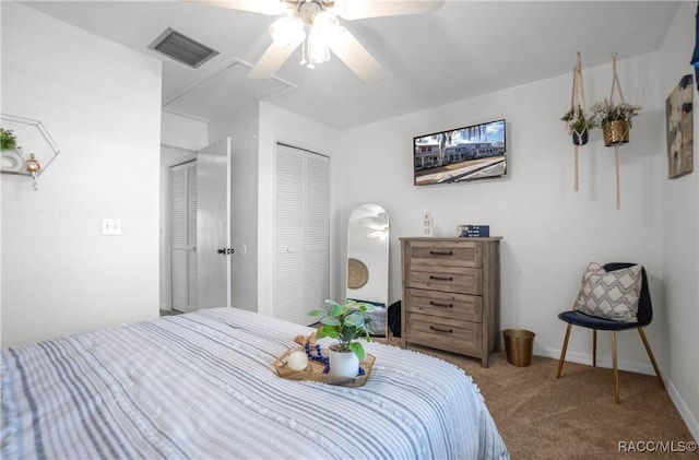 carpeted bedroom featuring ceiling fan and a closet