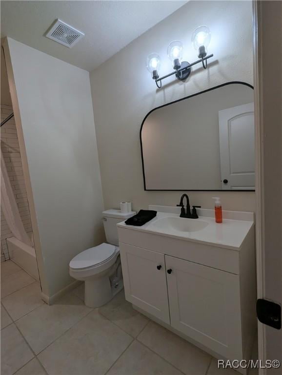 full bathroom featuring toilet, shower / bath combo, vanity, and tile patterned floors