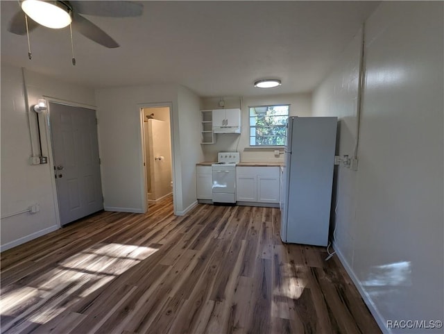 kitchen featuring white appliances, dark wood-type flooring, white cabinets, ceiling fan, and independent washer and dryer