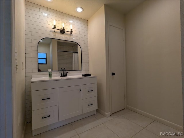 bathroom with a shower with curtain, tile patterned flooring, and vanity