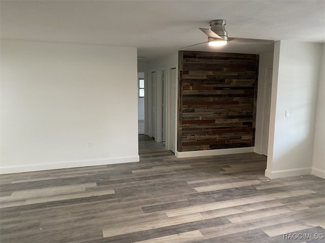 empty room with dark hardwood / wood-style flooring