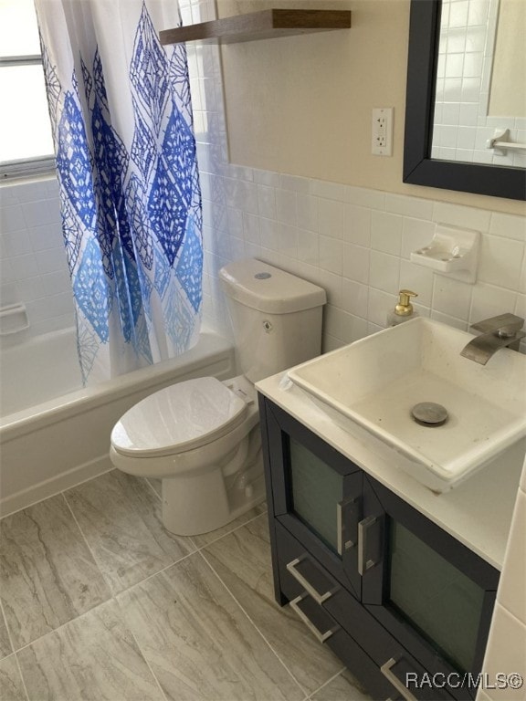 full bathroom with toilet, shower / tub combo with curtain, tile walls, and sink