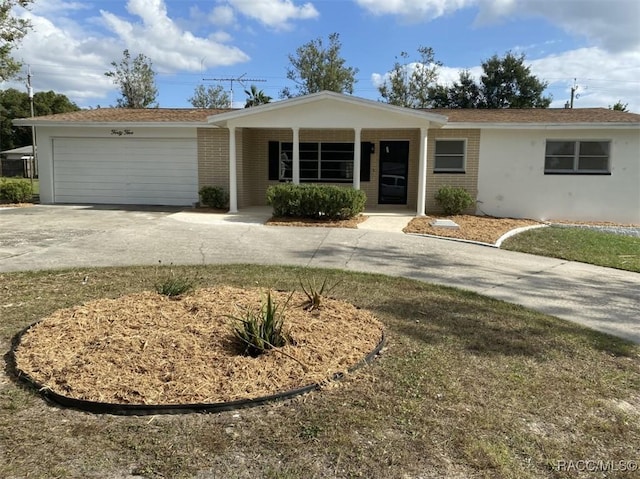 45 S Davis St, Beverly Hills, FL 34465 - ranch-style home with driveway, brick siding, a garage, and a porch
