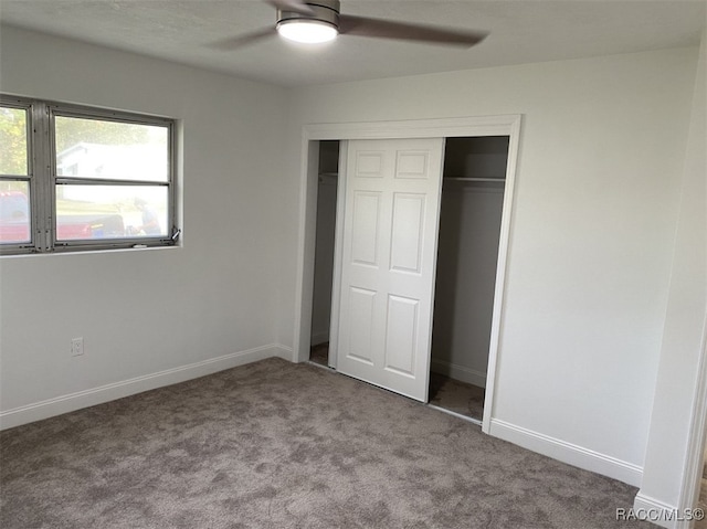 unfurnished bedroom featuring carpet flooring, a closet, and ceiling fan