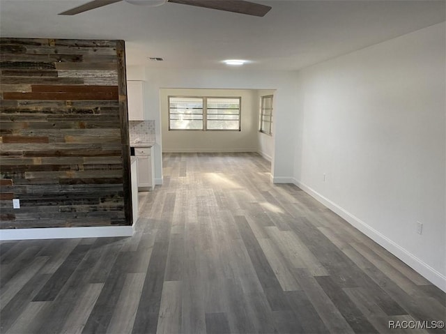 45 S Davis St, Beverly Hills, FL 34465 - unfurnished living room with a ceiling fan, wood finished floors, and baseboards