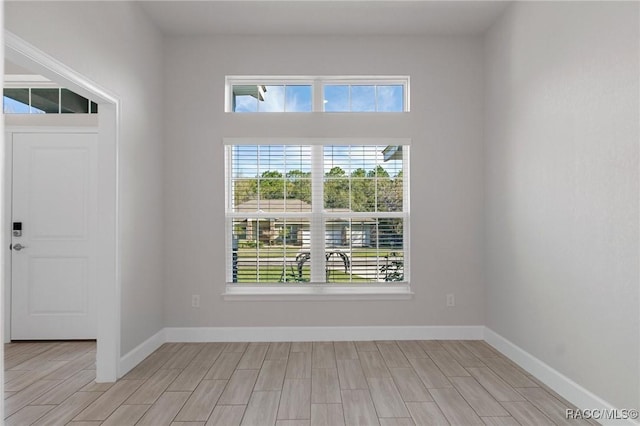 interior space with light wood-style flooring and baseboards