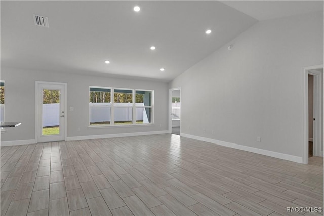 unfurnished living room with light wood-type flooring, visible vents, baseboards, and recessed lighting