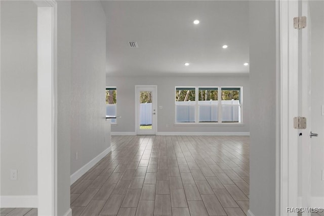 interior space with visible vents, recessed lighting, baseboards, and wood finished floors