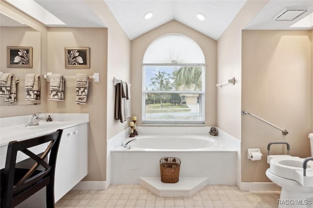 bathroom with lofted ceiling with skylight, a bidet, vanity, a bath, and tile patterned flooring