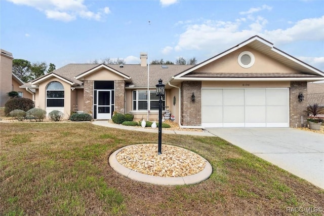 ranch-style house with a garage and a front lawn