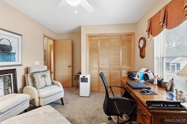 office area with light colored carpet and ceiling fan