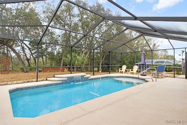 view of swimming pool featuring pool water feature, a patio, and glass enclosure