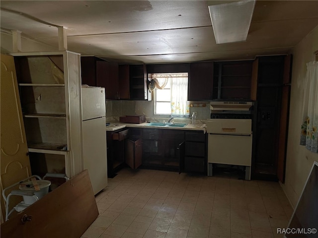 120 NW Magnolia Cir, Crystal River, FL 34428 - kitchen with open shelves, light countertops, and freestanding refrigerator
