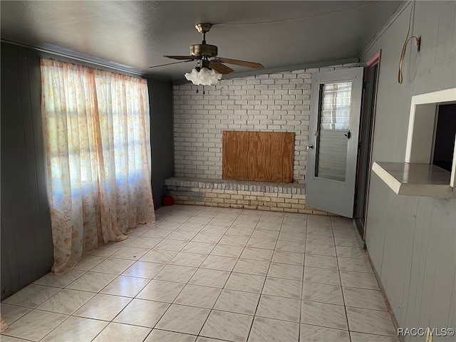 120 NW Magnolia Cir, Crystal River, FL 34428 - unfurnished room featuring healthy amount of natural light, ceiling fan, ornamental molding, and light tile patterned floors