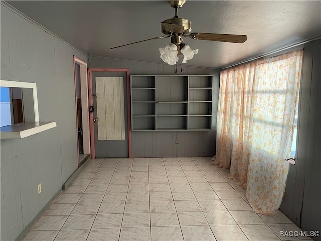 120 NW Magnolia Cir, Crystal River, FL 34428 - unfurnished room with a ceiling fan and wooden walls