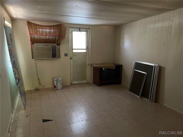 120 NW Magnolia Cir, Crystal River, FL 34428 - unfurnished living room featuring wood walls and a wall unit AC