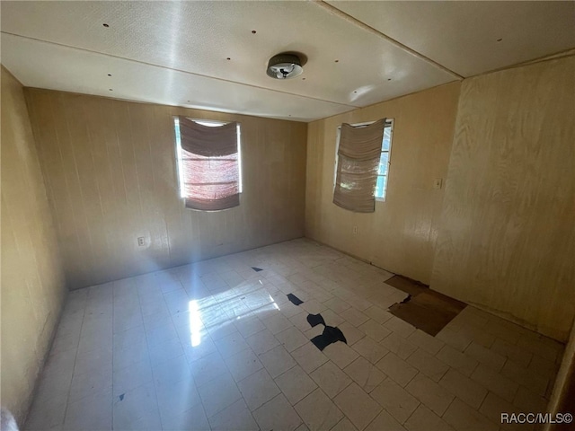120 NW Magnolia Cir, Crystal River, FL 34428 - spare room featuring wooden walls