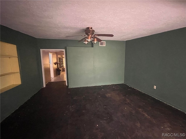 120 NW Magnolia Cir, Crystal River, FL 34428 - spare room featuring ceiling fan and a textured ceiling