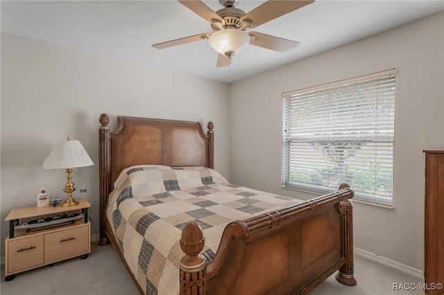 bedroom featuring light carpet and ceiling fan