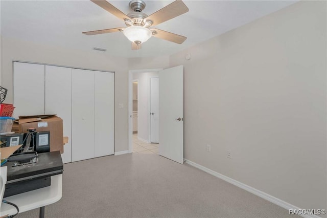 office featuring light colored carpet and ceiling fan