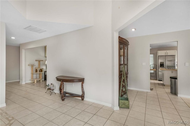 hall with light tile patterned flooring