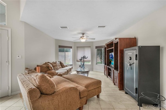 living room with light tile patterned flooring and ceiling fan