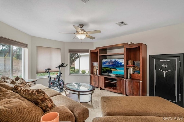 living room with light tile patterned floors and ceiling fan