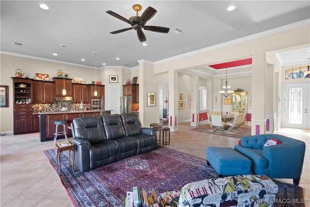 tiled living room featuring ornamental molding and ceiling fan with notable chandelier