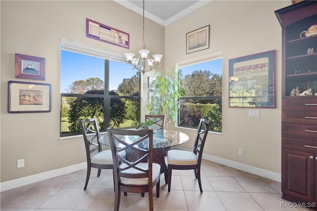 dining room featuring light tile patterned floors, crown molding, and a chandelier