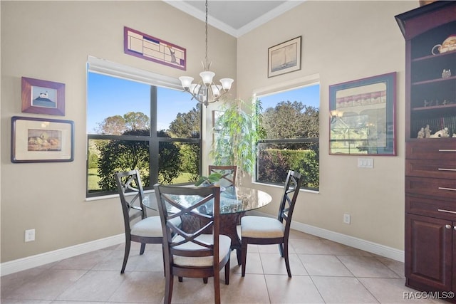 dining room with light tile patterned floors, a notable chandelier, and ornamental molding