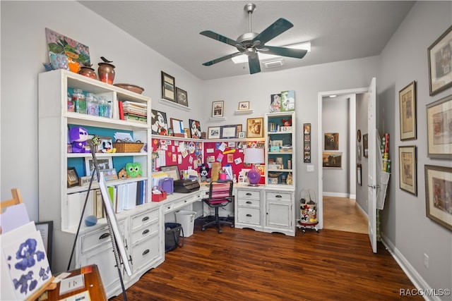 office area with a textured ceiling, dark hardwood / wood-style flooring, and ceiling fan